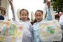 Children show their environment-friendly bags with hand drawings in Tian'ehu community in Hefei, east China's Anhui Province, April 19, 2017. China's annual political sessions of the National People's Congress (NPC) and the National Committee of the Chinese People's Political Consultative Conference (CPPCC) are scheduled to convene in March, 2018. During the two sessions, development agendas will be reviewed and discussed, and key policies will be adopted. Year 2018 marks the first year of fully implementing the spirit of the 19th National Congress of the Communist Party of China, which vowed to pursue the vision of innovative, coordinated, green, and open development that is for everyone. The CPC congress stressed that building an ecological civilization is vital to sustain the Chinese nation's development, 