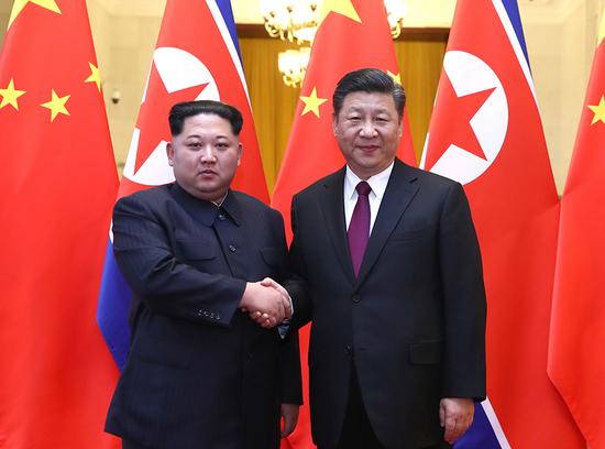 At the invitation of Xi Jinping, general secretary of the Central Committee of the Communist Party of China (CPC) and Chinese president, Kim Jong Un, chairman of the Workers' Party of Korea (WPK) and chairman of the State Affairs Commission of the Democratic People's Republic of Korea (DPRK), paid an unofficial visit to China from March 25 to 28. During the visit, Xi held talks with Kim at the Great Hall of the People in Beijing. Xi held a welcoming ceremony for Kim before their talks. (Xinhua/Ju Peng)
